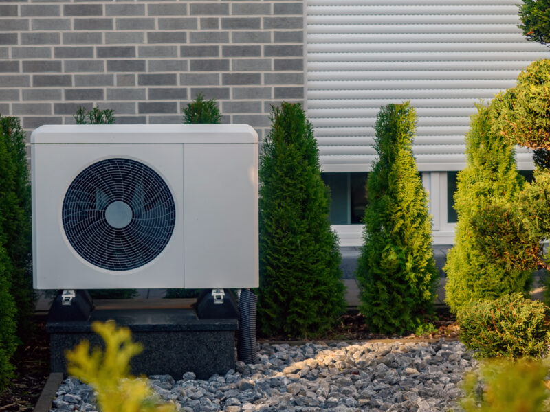 Outdoor,Heat,Pump,Unit,Set,Within,Well kept,Garden,Of,Trimmed