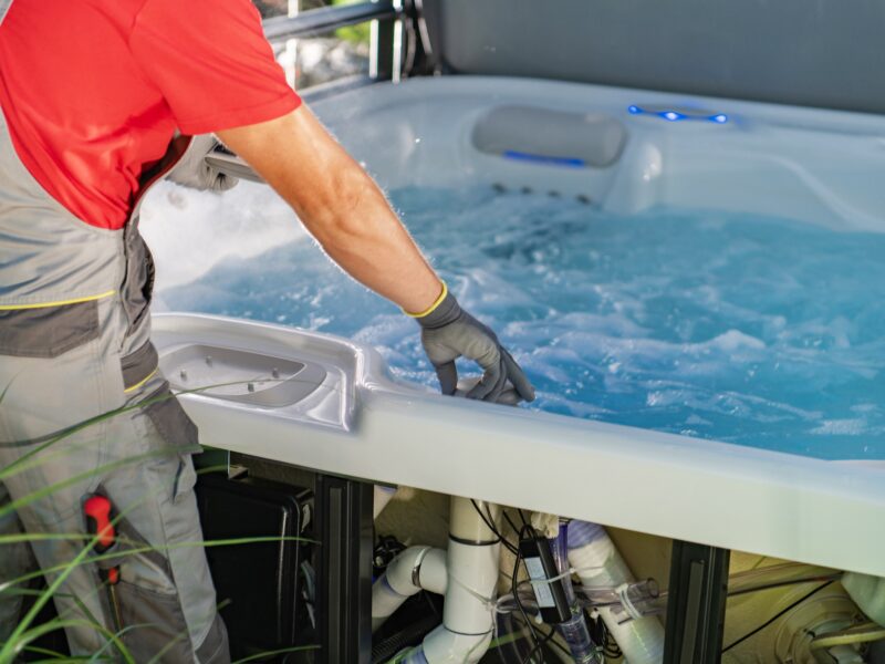A,Spa,Technician,Works,Carefully,On,A,Hot,Tub,,Ensuring